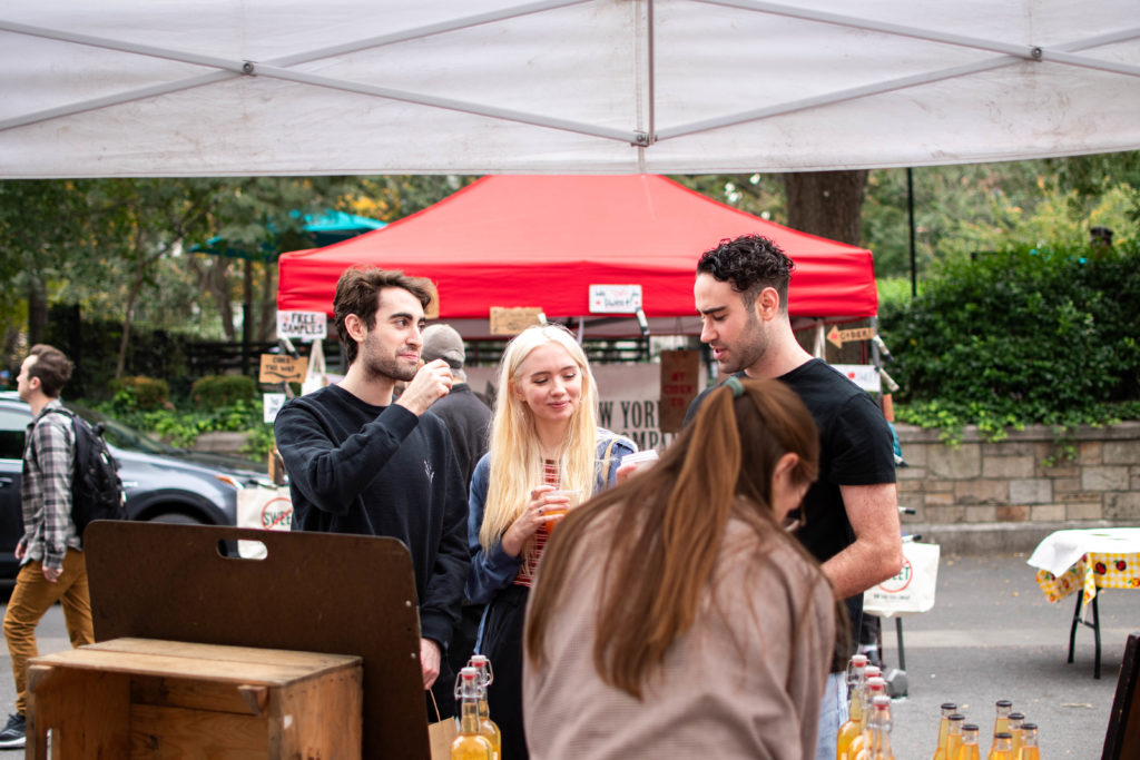 People tasting cider at a cider festival in New York City