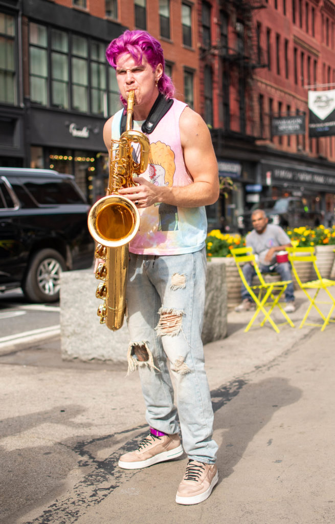 Too Many Zooz Baritone Saxophone Player Leo Pellegrino performing in Union Square New York City