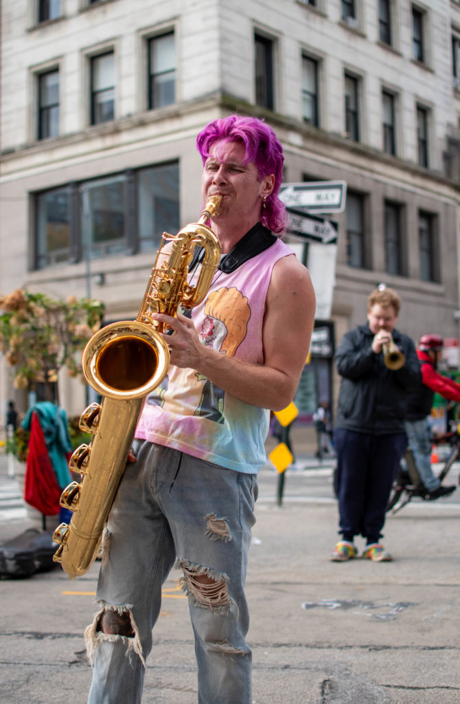 Too Many Zooz Baritone Saxophone Player Leo Pellegrino performing in Union Square New York City